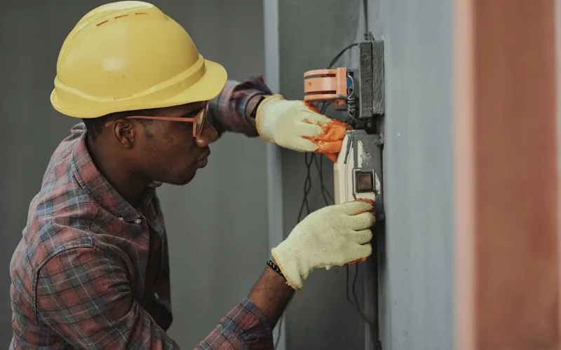 Electrician working with professional tools